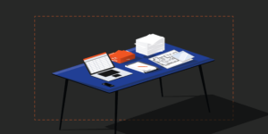 Illustration of desk with laptop, construction drawing, and submittals process paperwork