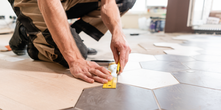 Photo of subcontractor laying tile