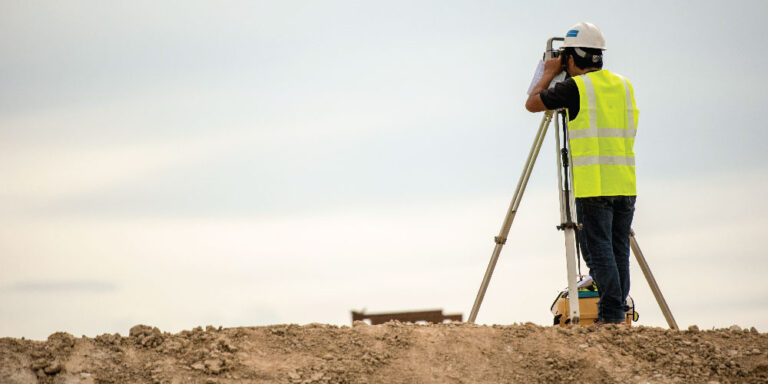 Surveyor conducting a construction survey