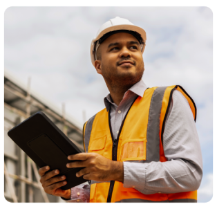 Man holding tablet in a construction site