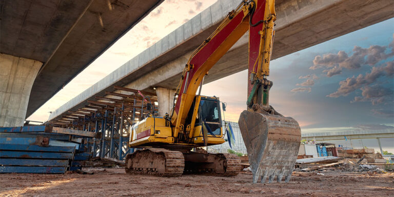 An excavator on a highway construction project