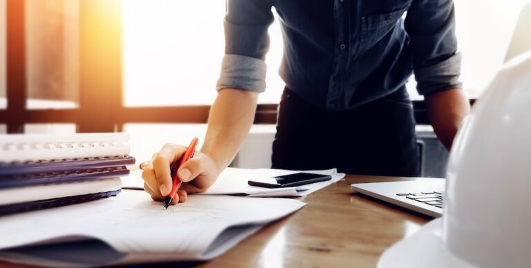 Person signing a contract document