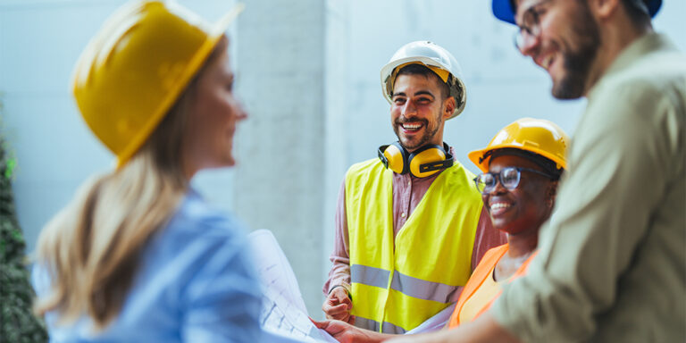 Construction team talking in a group