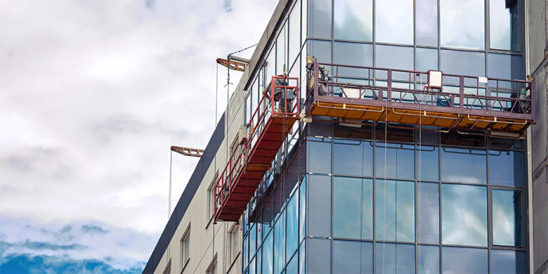 Post-construction window work being done on a building