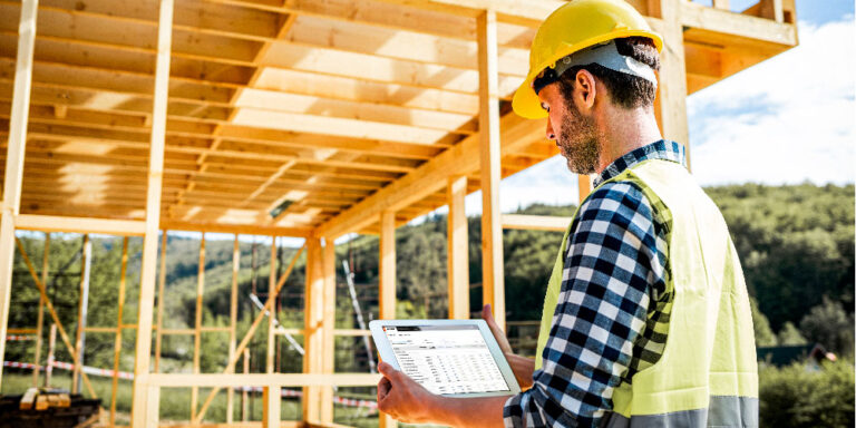 Construction framing inspection taking place on a jobsite wooden frame