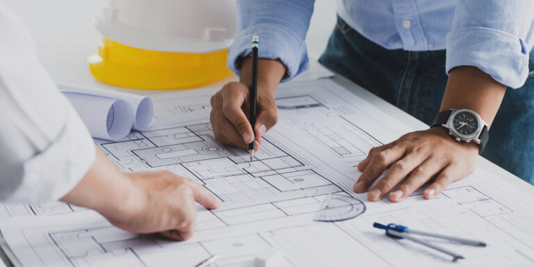 Construction team looking over drawings.