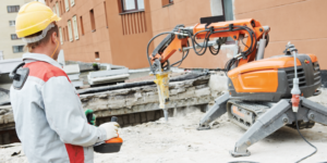 Construction robotics working in concrete on a jobsite.