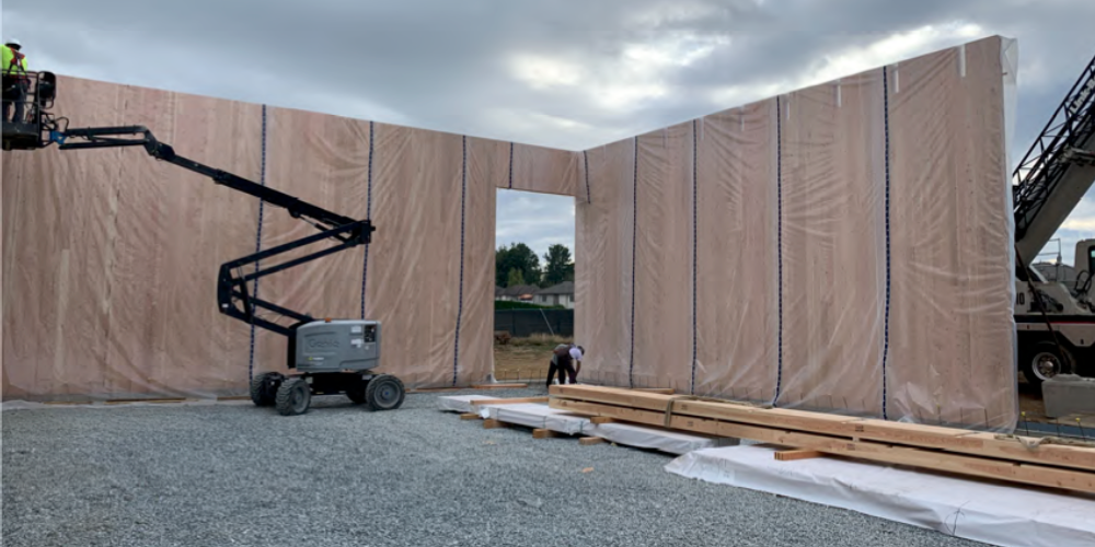 Photo of plastic wrapped wooden walls for a gymnasium project.