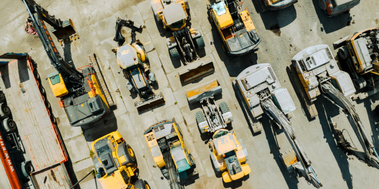 An aerial view of rows of construction equipment