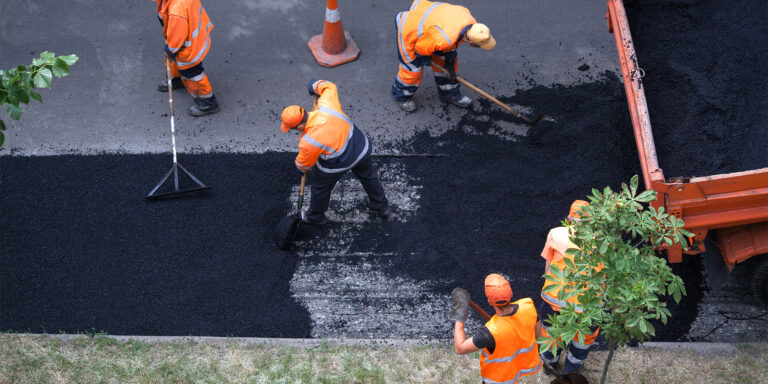 Photo of a road resurfacing crew at work