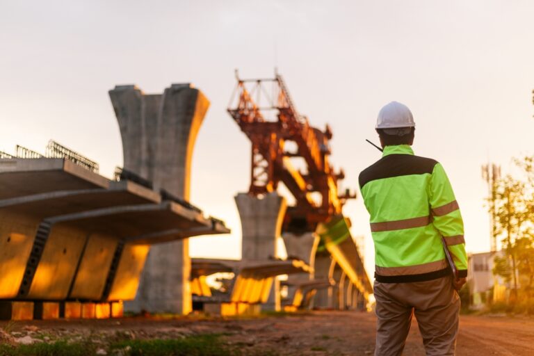 Construction workers at an infrastructure road project worksite