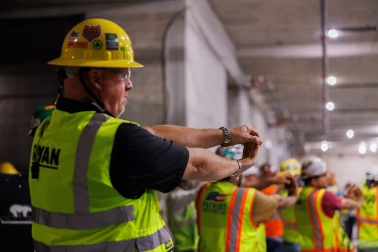 Construction company team doing an exercise together.